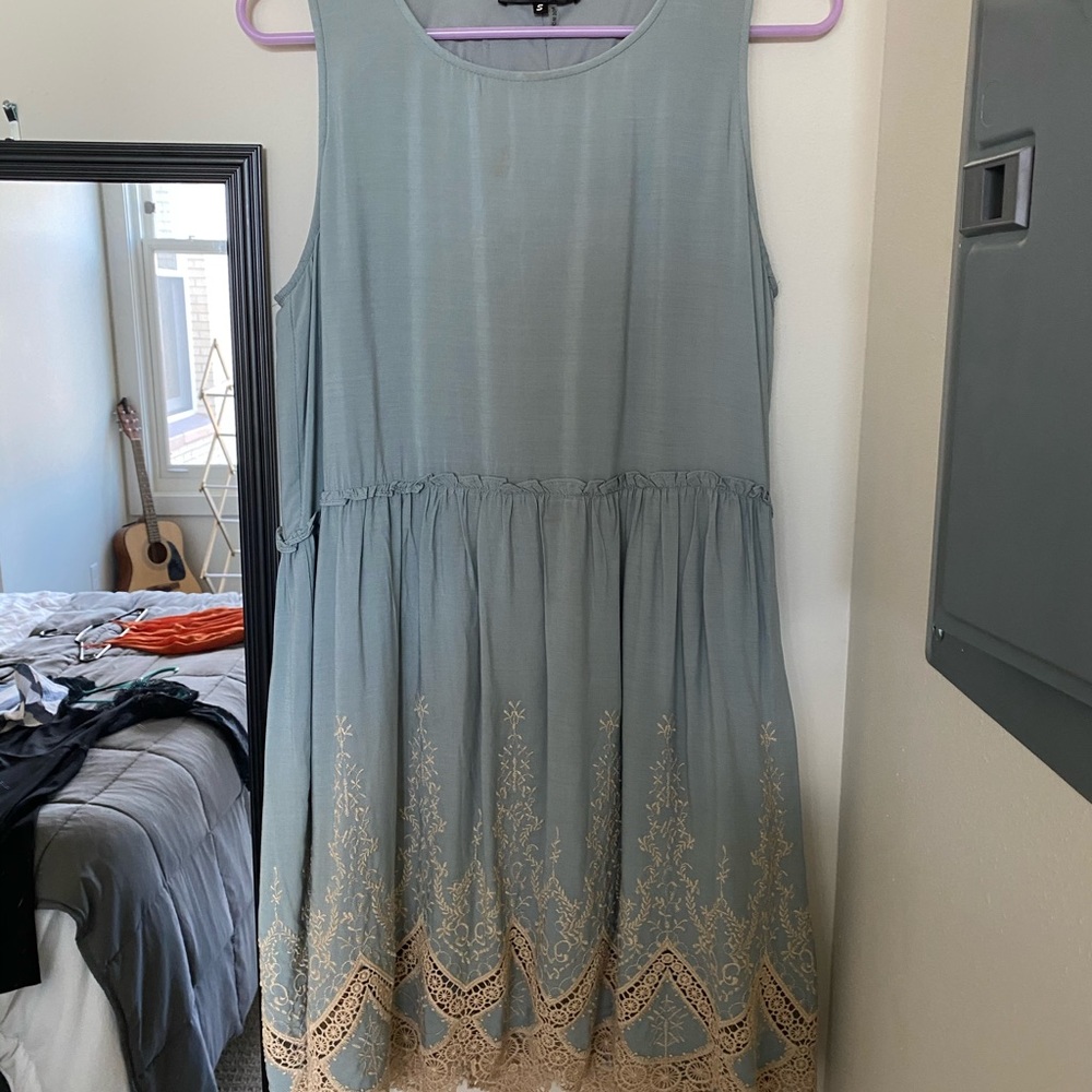 Light blue baby doll dress with lace detail.